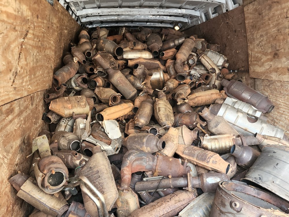 A van with seized catalytic converter thefts is parked outside police headquarters in Mineola, New York, on Jan. 30, 2023.
