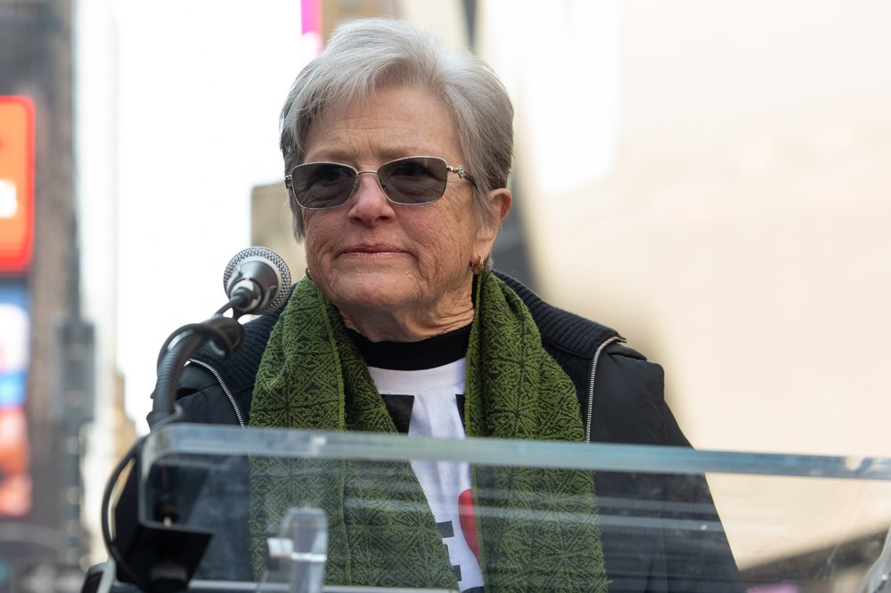 A woman at a podium.