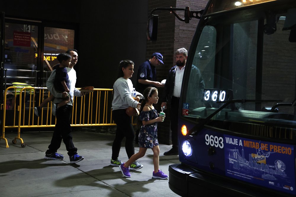 Migrants arrive at the Port Authority in Midtown Manhattan on May 15, 2023.