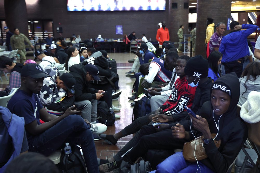 - MAY 15: Asylum seekers are held prior to being transferred via city bus from Port Authority bus terminal to housing facilities in the Bronx and Queens on May 15, 2023 in New York City.