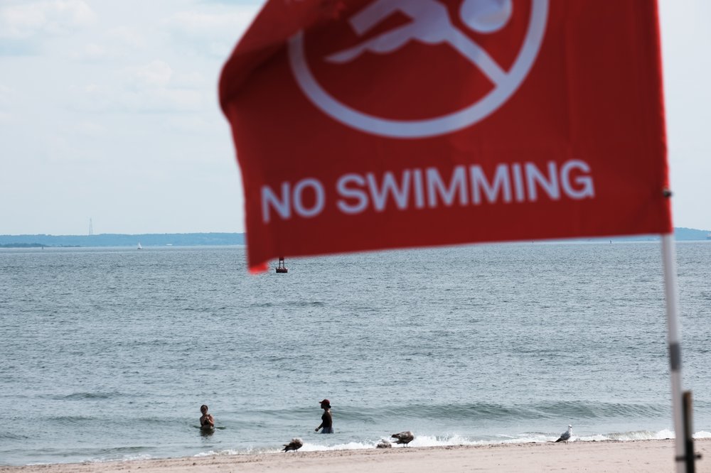 A "no swimming" sign at a New York City beach.