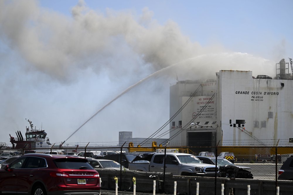 Firefighters respond a fire on a ship docked at Port Newark, New Jersey, United States on July 6, 2023.