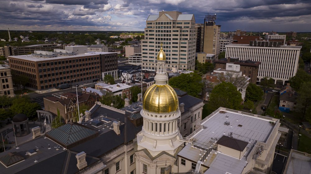 An aerial view of the Trenton skyline, with state's golden Capitol dome at the center.