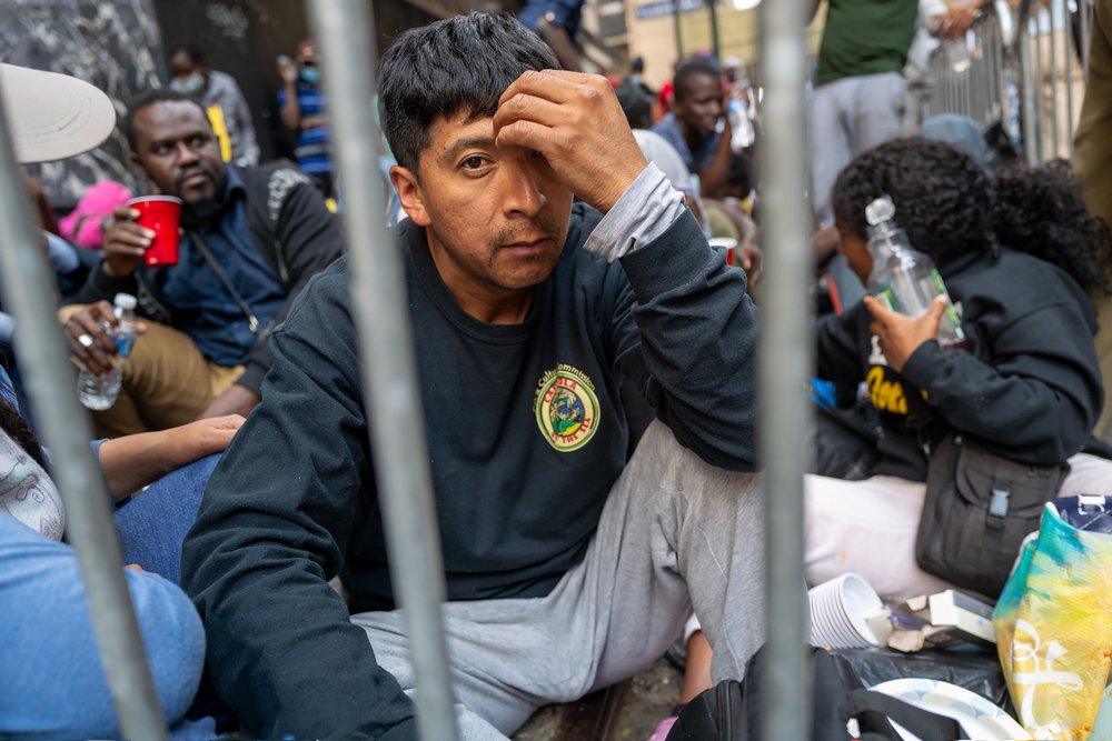 Photo of migrants outside the Roosevelt Hotel in Manhattan
