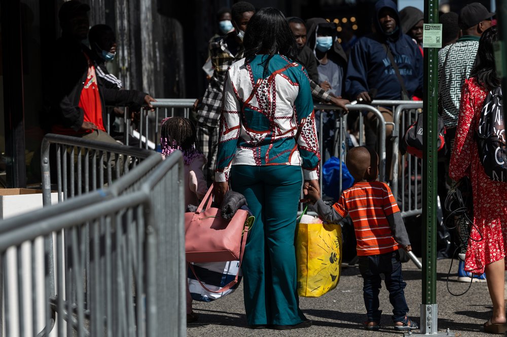 Migrant families arriving at New York's central intake center at the Roosevelt Hotel in August 2023.