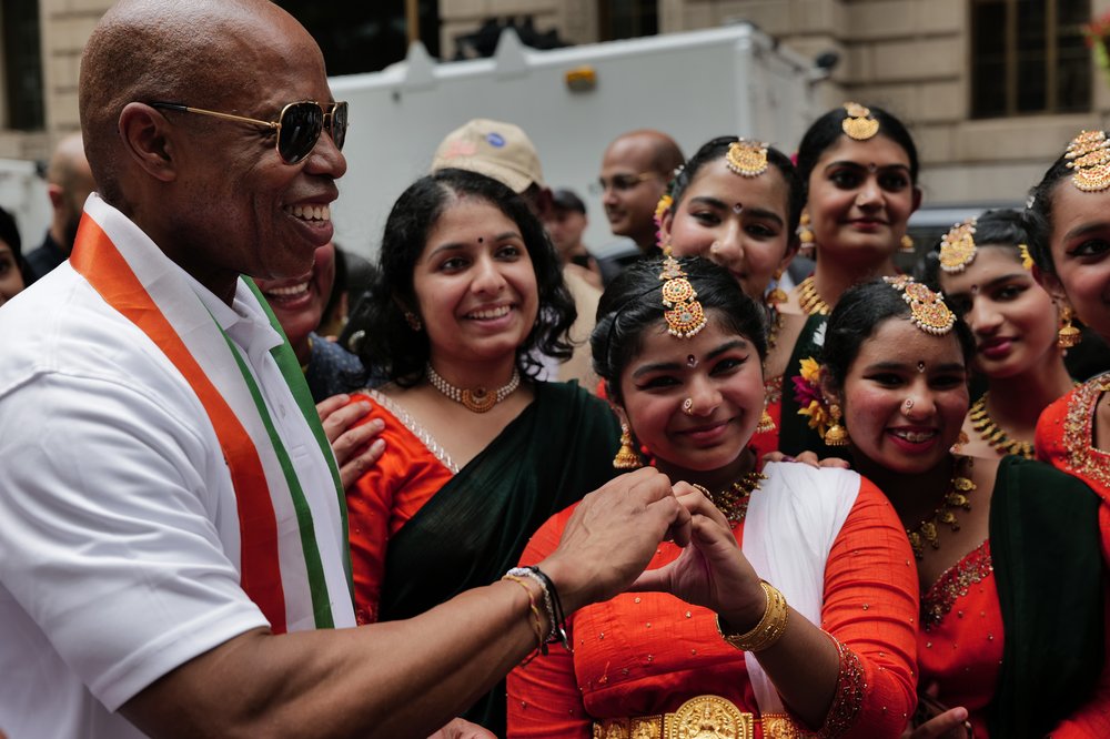 Mayor Eric Adams poses for a picture with young Indian Americans in traditional dress during a flag-raising ceremony in Lower Manhattan to mark India's 77th Independence Day on Aug. 15, 2023.