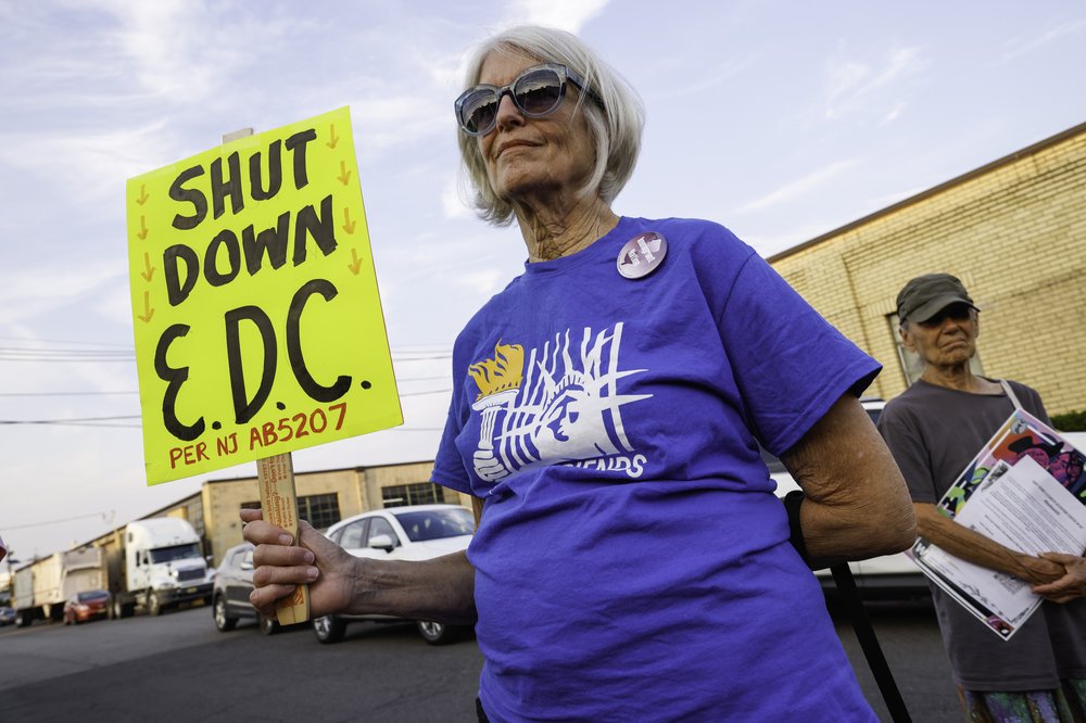 A woman attends a protest outside the Elizabeth Detention Center on Aug. 20.