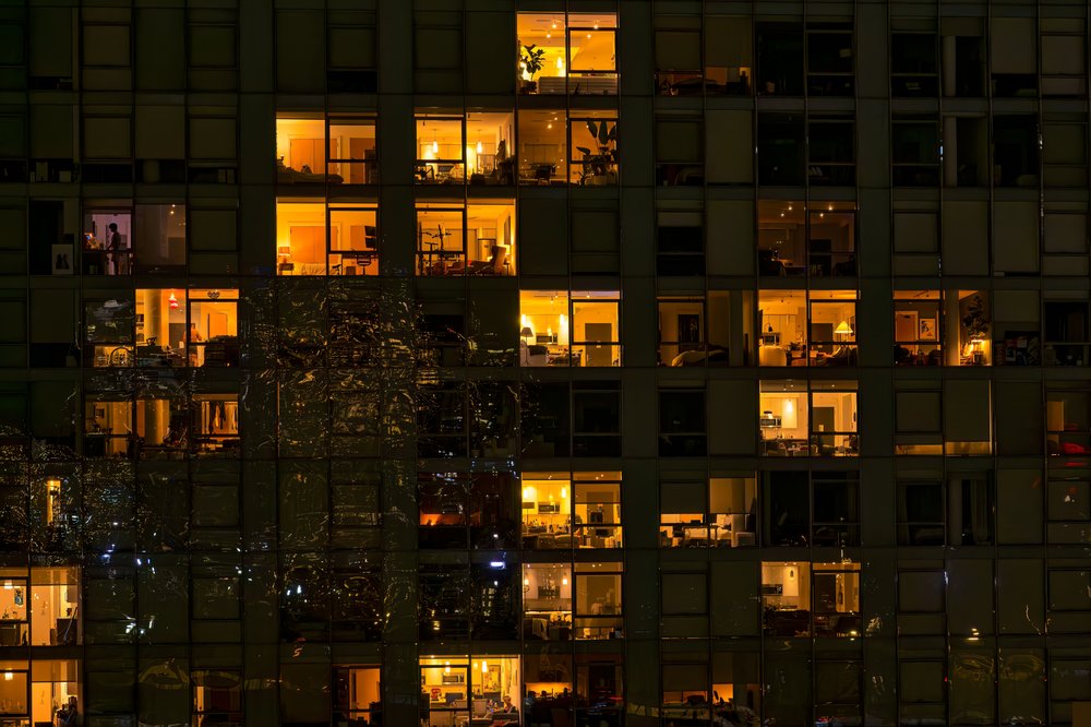 A view of apartment windows at night in Brooklyn