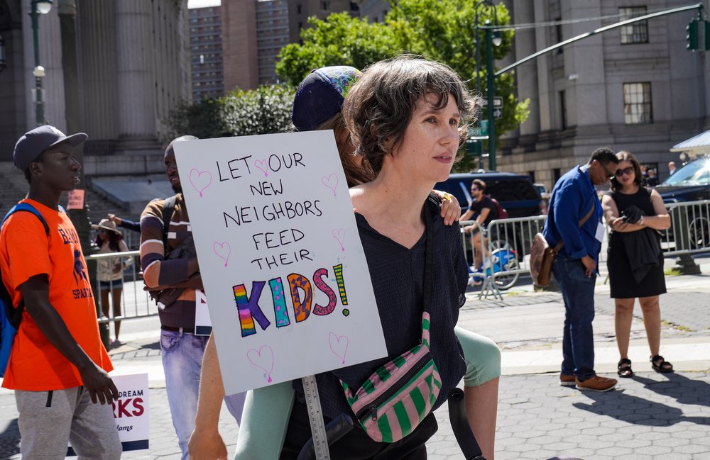 Photo of August rally in New York in support of migrants looking to work.
