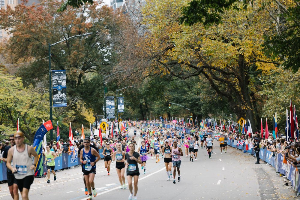 A crowd of runners finishes in Central Park.