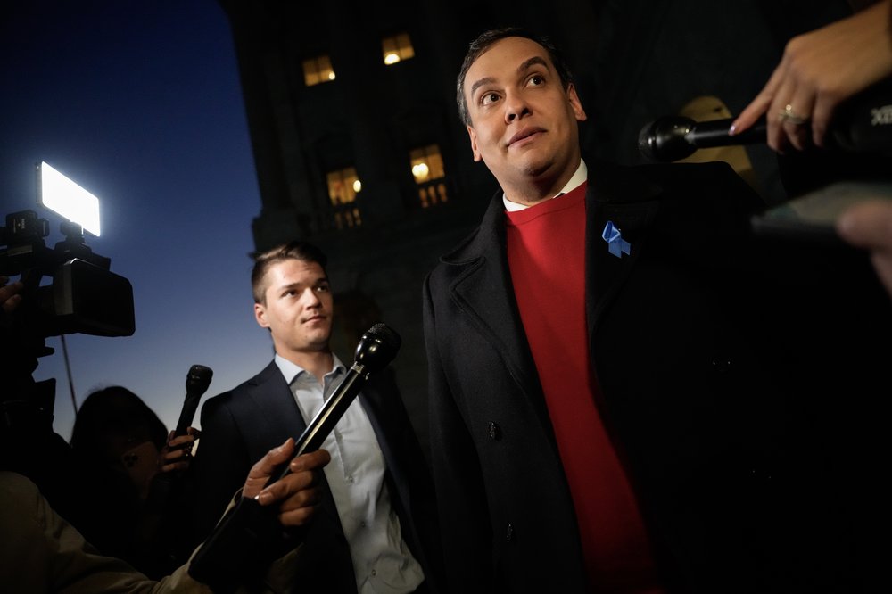 Rep. George Santos speaks to reporters outside the U.S. Capitol before the House votes on his explosion resolution Nov. 1, 2023.