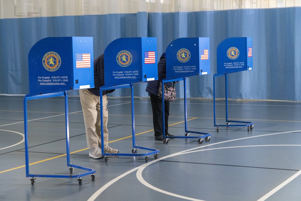 Voters cast their ballots at a gym on Long Island.