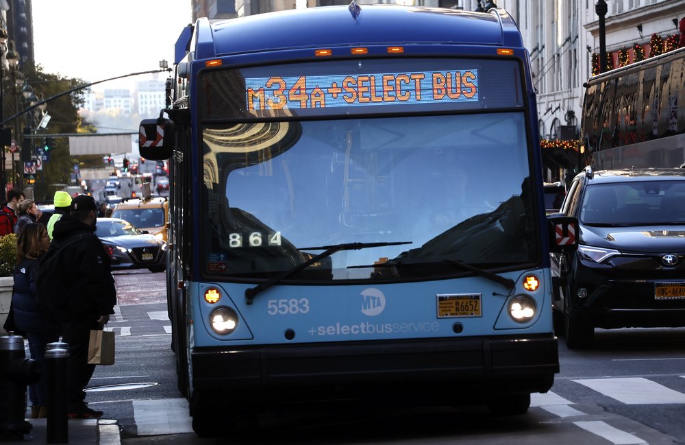 An MTA bus stops to pick up passengers on 34th Street in Herald Square on in 2023.