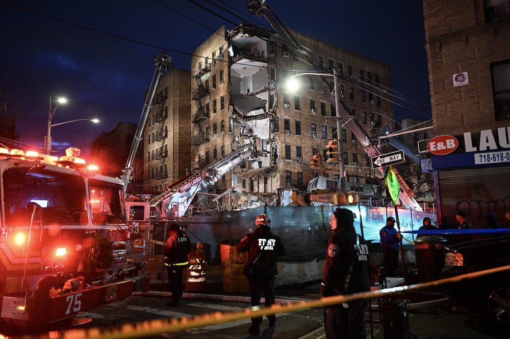 Emergency responders, firefighters respond after a partial building collapse in the Bronx.