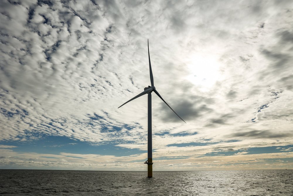 A wind turbine in the ocean.