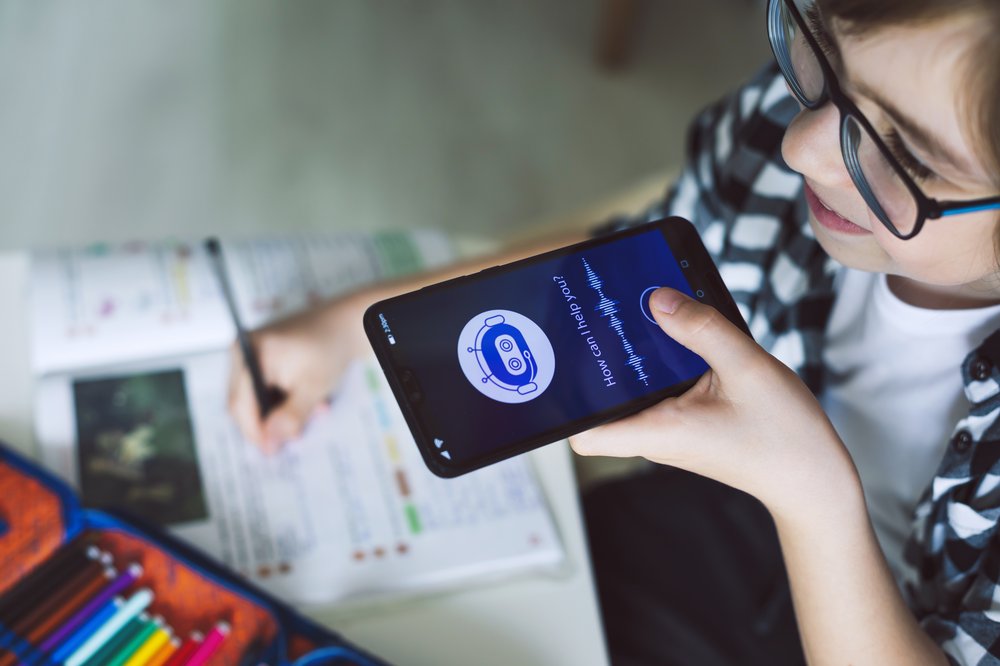 A child using an AI chatbot on a smartphone.