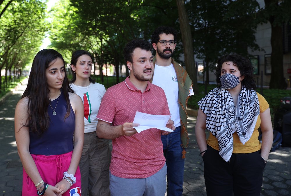 Columbia University student Mahmoud Khalil, center, talks to the press during the press briefing organized by Pro-Palestinian protesters who set up a new encampment at Columbia University's Morningside Heights campus in June, 2024.