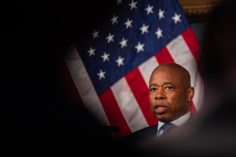New York City Mayor Eric Adams seen through a dark ring