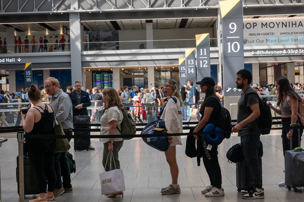 People move through Moynihan Train Hall a day before the 4th of July holiday in New York City.