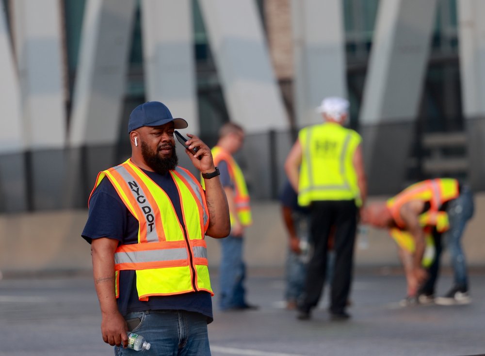 City Transportation Department workers service the Third Avenue Bridge after it was stuck in the open position on Monday afternoon.