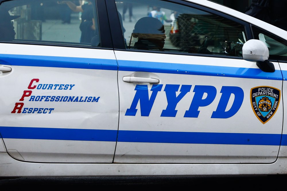 The side of an NYPD car.
