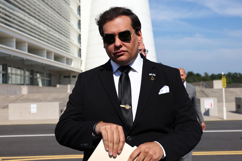 Former Rep. George Santos of New York appears outside federal court in Central Islip on Aug. 19, 2024.