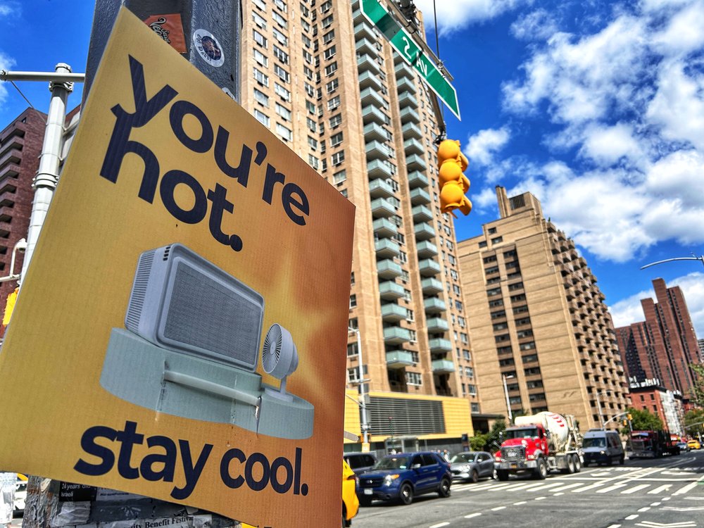 A stay-cool sign is seen on 86th Street in Manhattan in August 2024.