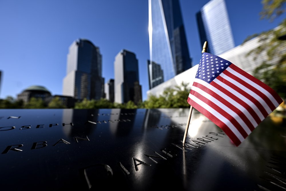 A 9/11 victim's name next to an American flag at the National September 11 Memorial and Museum.