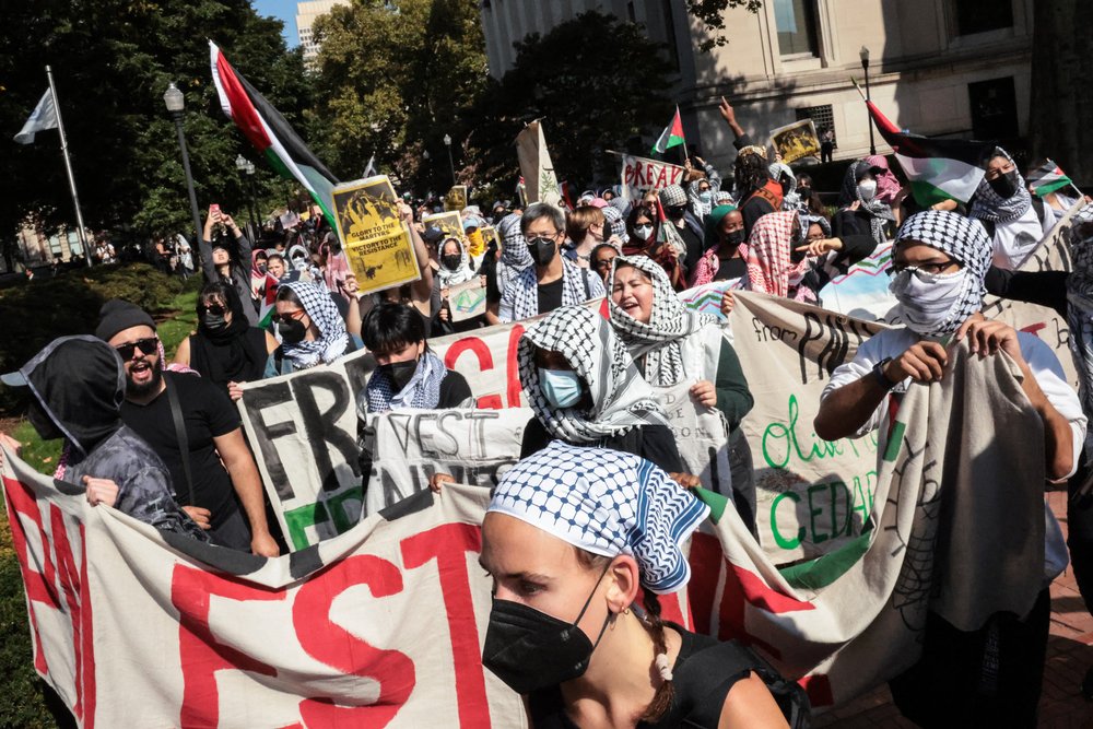 Pro-Palestinian demonstrators march through the Columbia University campus to mark one year of the war between Hamas and Israel in New York City on Oct. 7, 2024.