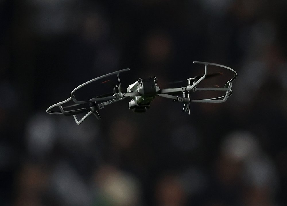 A drone flies over a crowd during an event in New York City.