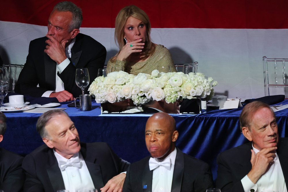 Mayor Adams and Robert F. Kennedy Jr. on a stage in tuxedos.