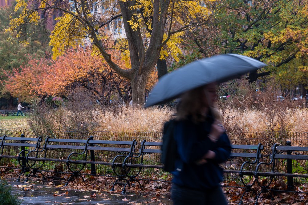 A person walks through the rain in Manhattan on Nov. 21, 2024.