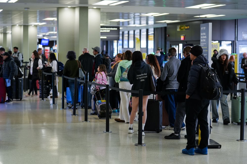 Travelers are seen at the Newark Liberty International Airport ahead of Thanksgiving holiday, in New Jersey.