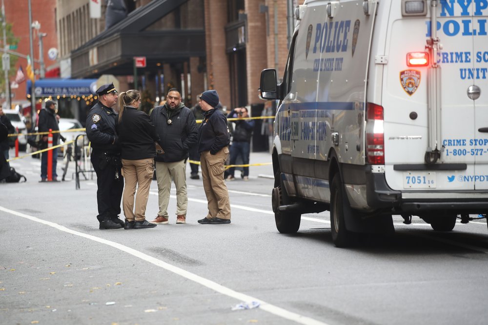 Police gather outside of a Hilton Hotel in Midtown Manhattan where United Healthcare CEO Brian Thompson was fatally shot on December 04, 2024 in New York City. Brian Thompson was shot and killed before 7:00 AM this morning outside the Hilton Hotel, just before he was set to attend the company's annual investors' meeting.