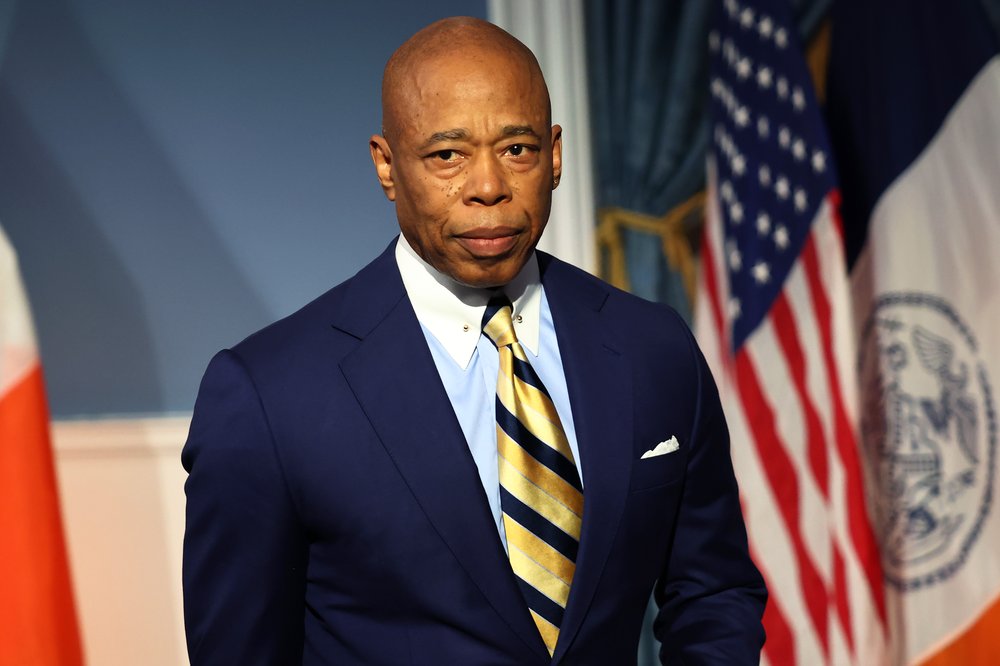Mayor Eric Adams pictured wearing a suit and photographed in 3/4 profile.