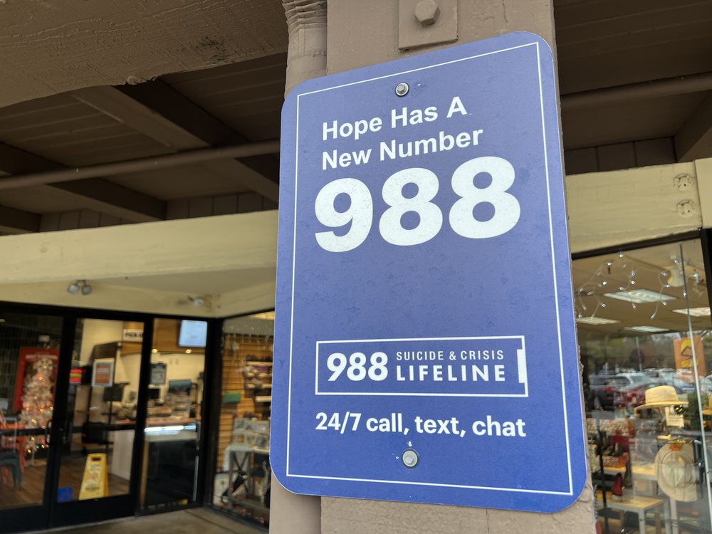 Sign for the 988 Lifeline mental health emergency hotline.