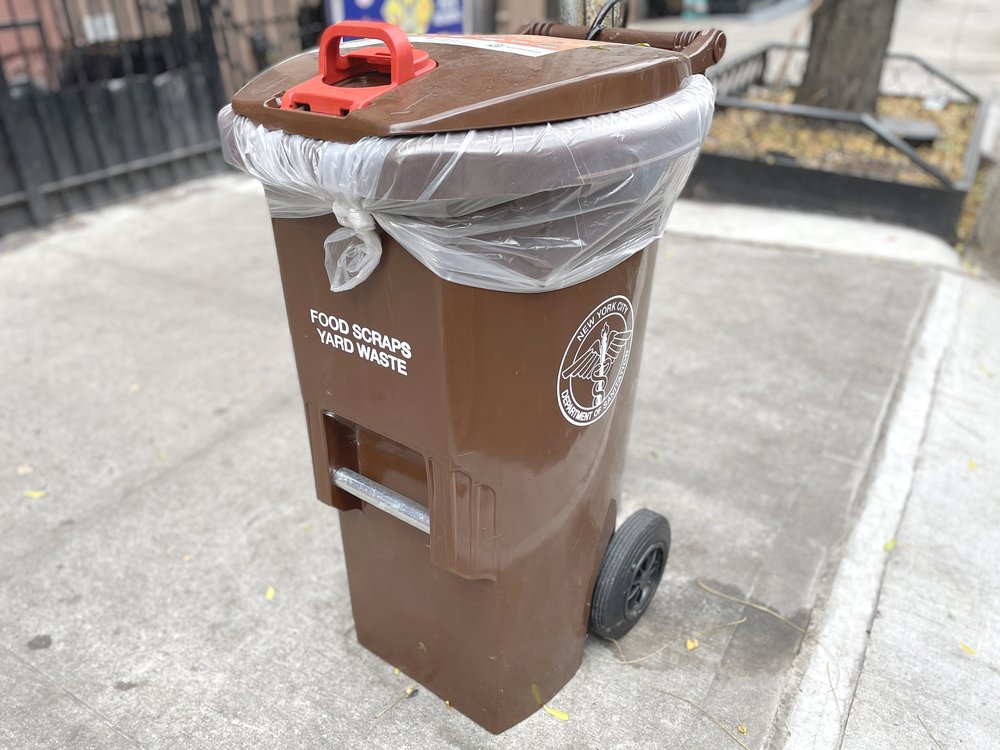 A brown compost bin.