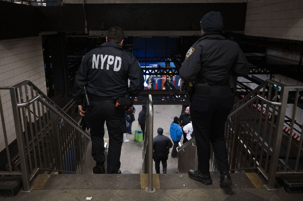 NYPD officers patrol inside a subway station in New York City.