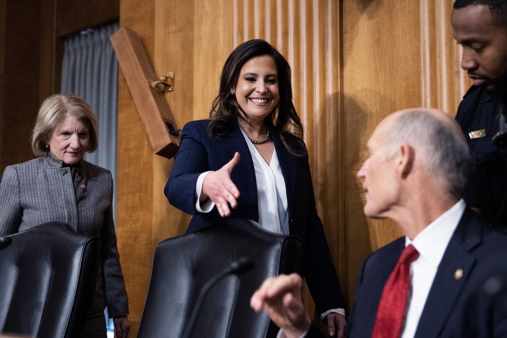 Rep. Elise Stefanik extends her hand for a handshake in the Senate chambers