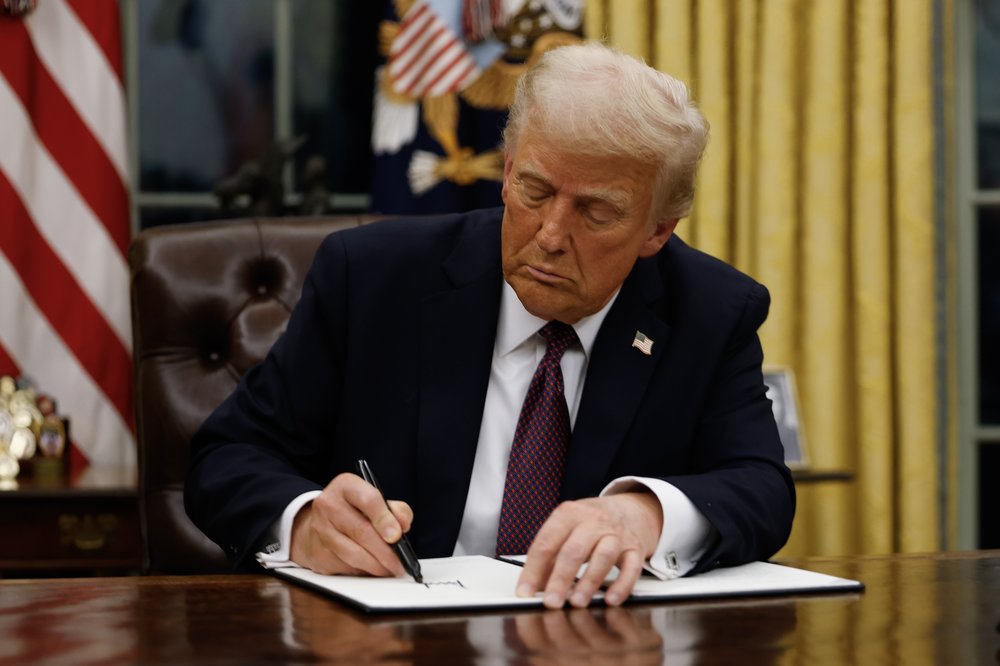 President Donald Trump signing an executive order.
