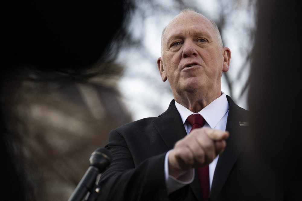Border czar Tom Homan seen from between two silhouettes