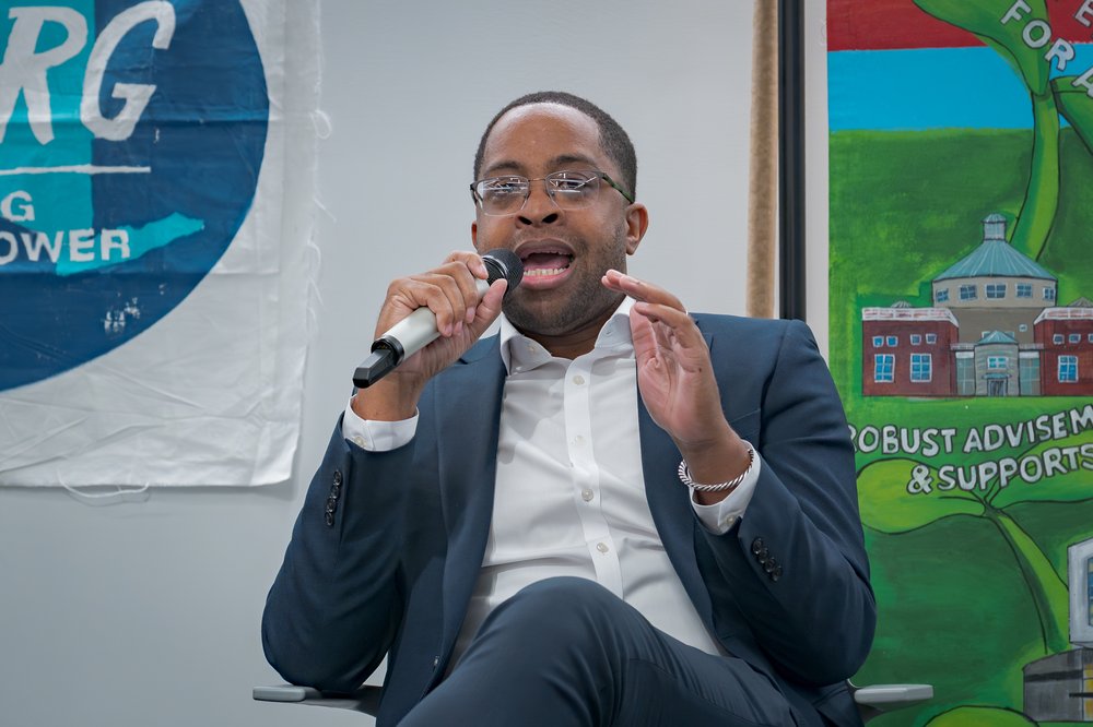 A politician holding a mic.
