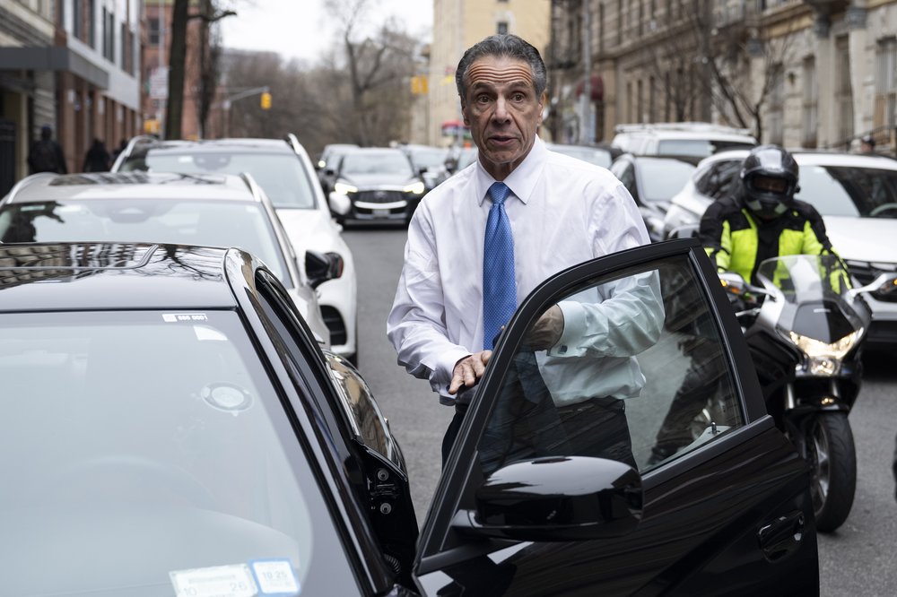 Andrew Cuomo gets into a car.