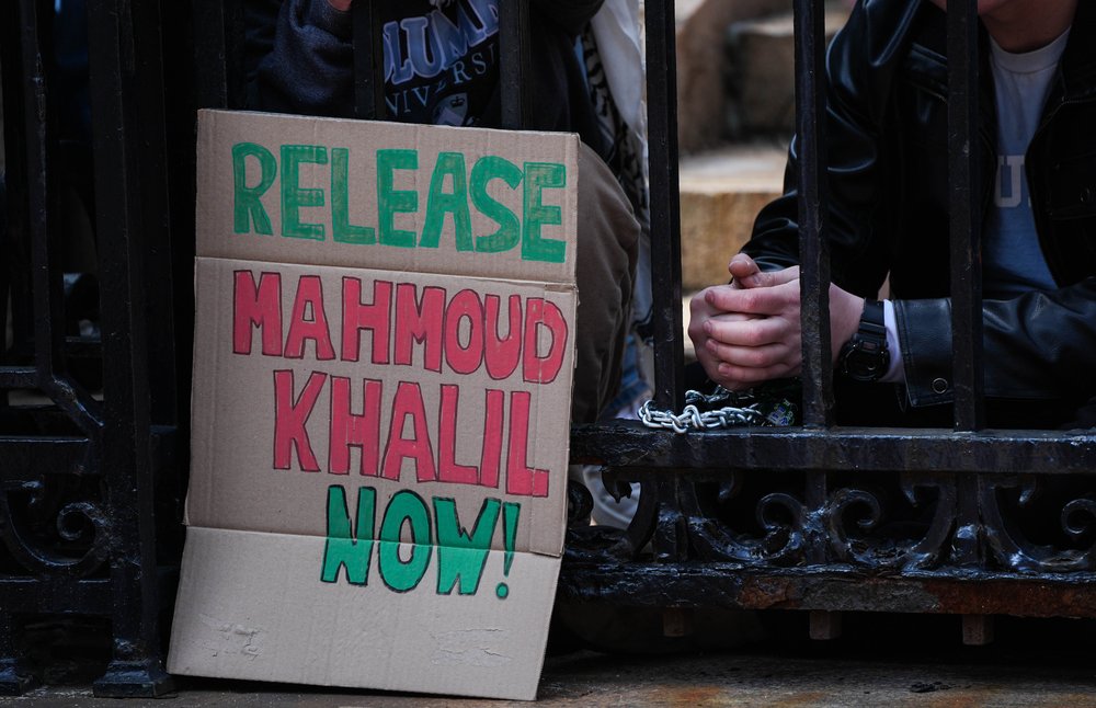 A sign reading "Release Mahmoud Khalil Now" is seen as Jewish students chain themselves to the gates of Columbia University, demanding accountability from the university's trustees following the arrest of Mahmoud Khalil, in New York, United States on April 2, 2025.