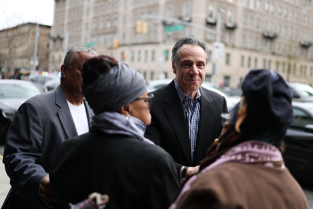 New York City mayoral candidate Andrew Cuomo, talks to people on the street as he arrives to attend a Sunday service at First Corinthian Baptist Church in the Harlem neighborhood of New York City on April 13, 2025.