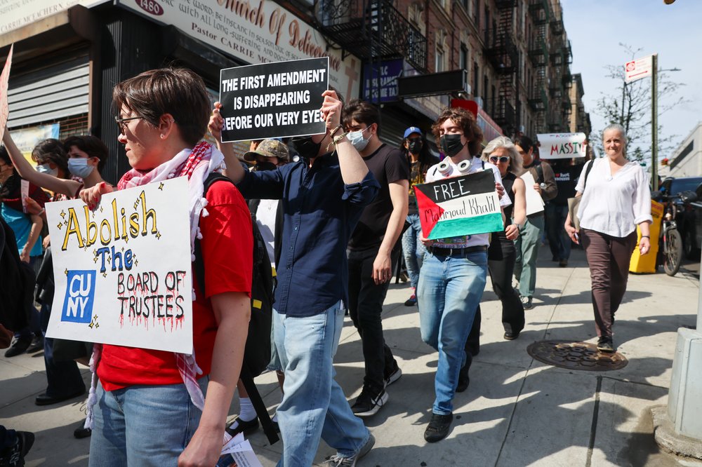 Protesters participate in a march and rally from City College to Columbia University on Friday.