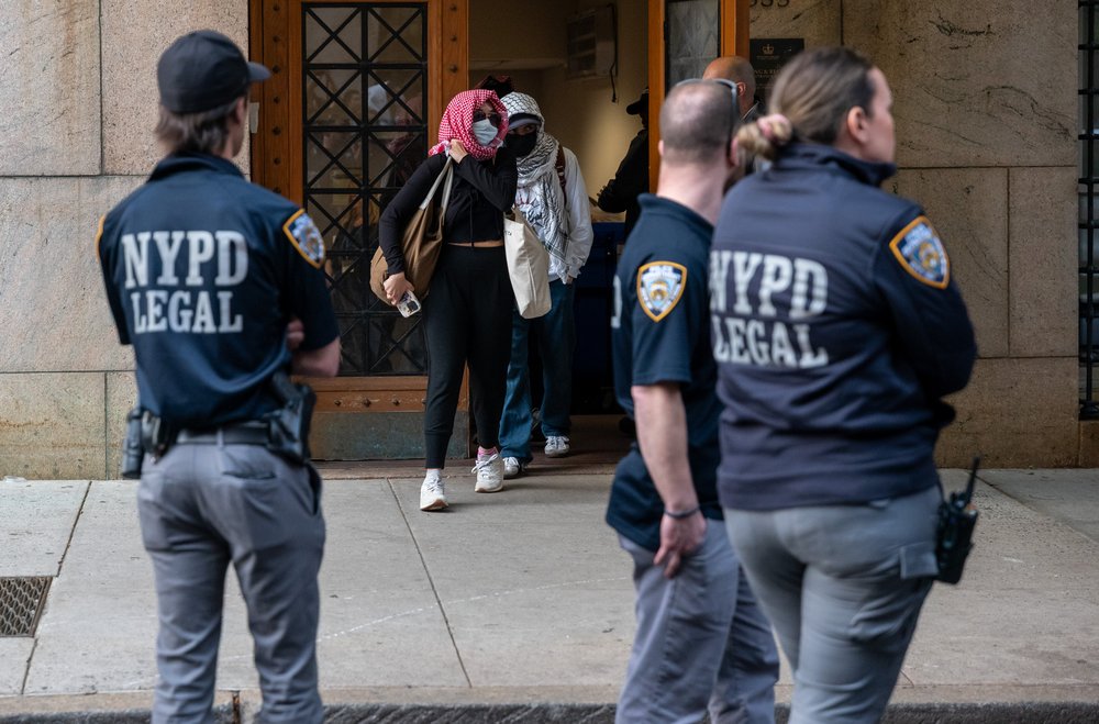 Protesters exit Columbia University's Butler Library after occupying the space on May 7, 2025 in New York City.