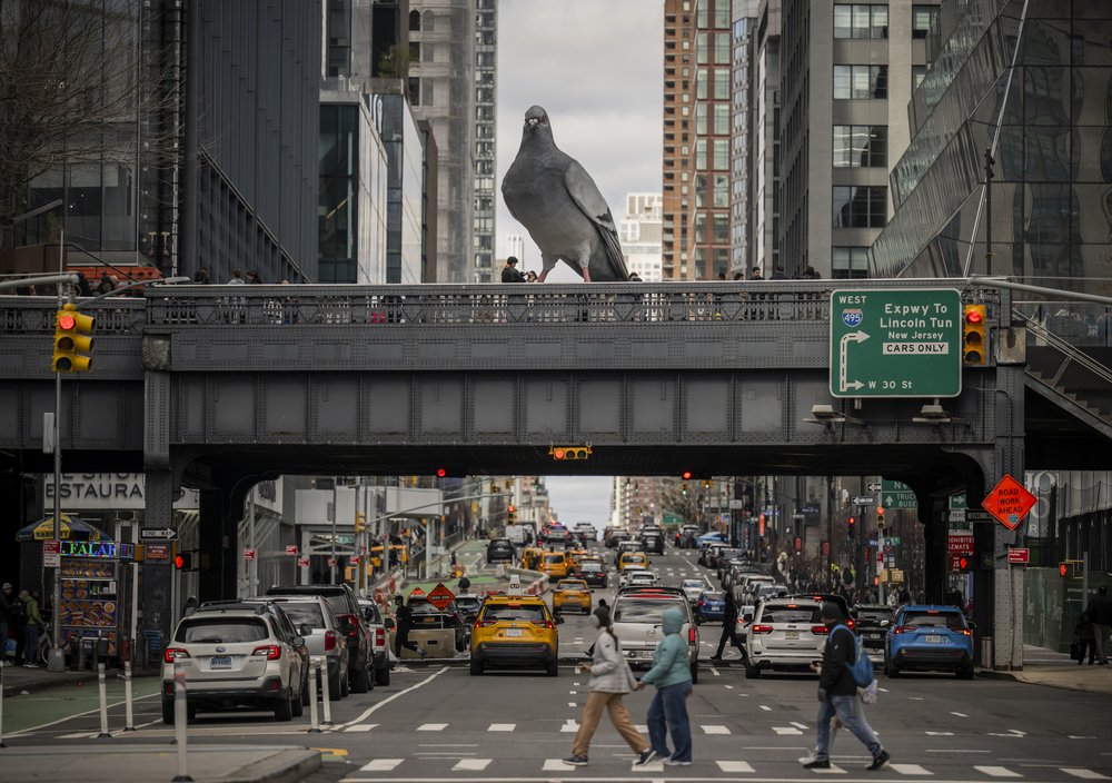 A sculpture of a pigeon titled 'Dinosaur' by Iván Argote is displayed on The High Line in April.