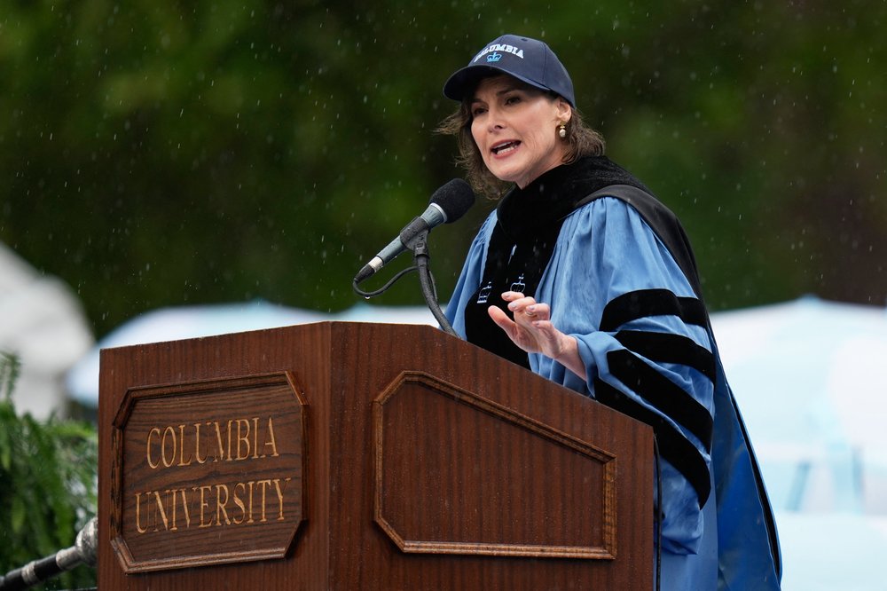A woman speaks at a podium.
