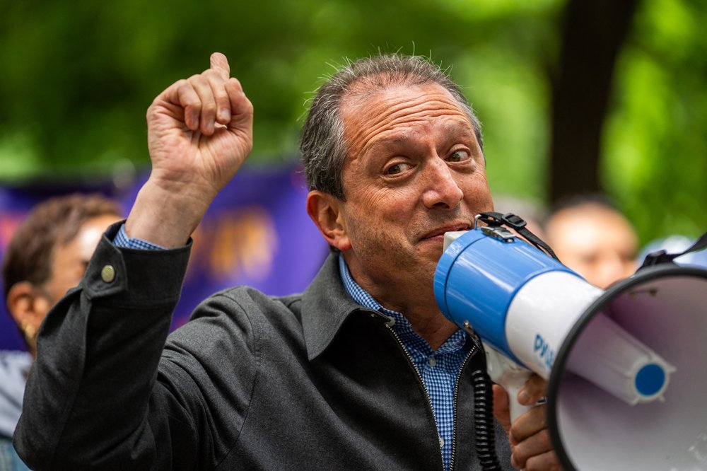 Brad Lander with a megaphone.